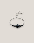 Pulsera midi con tortuga howlita negra cuentas de lava negra