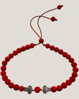 Pulsera con tortuguitas amor plateadas y lava roja