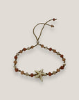 Pulsera Eloise con estrella howlita y cristales facetados naranjas, coral y crema